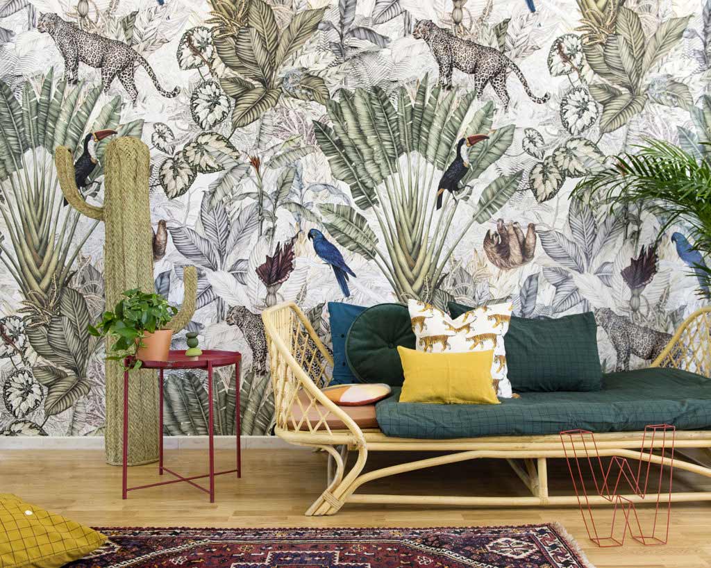 stylish rattan sofa with chic jungle wallpaper